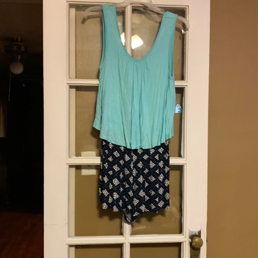 This aqua and blue multi romper is brand new from Rue21.